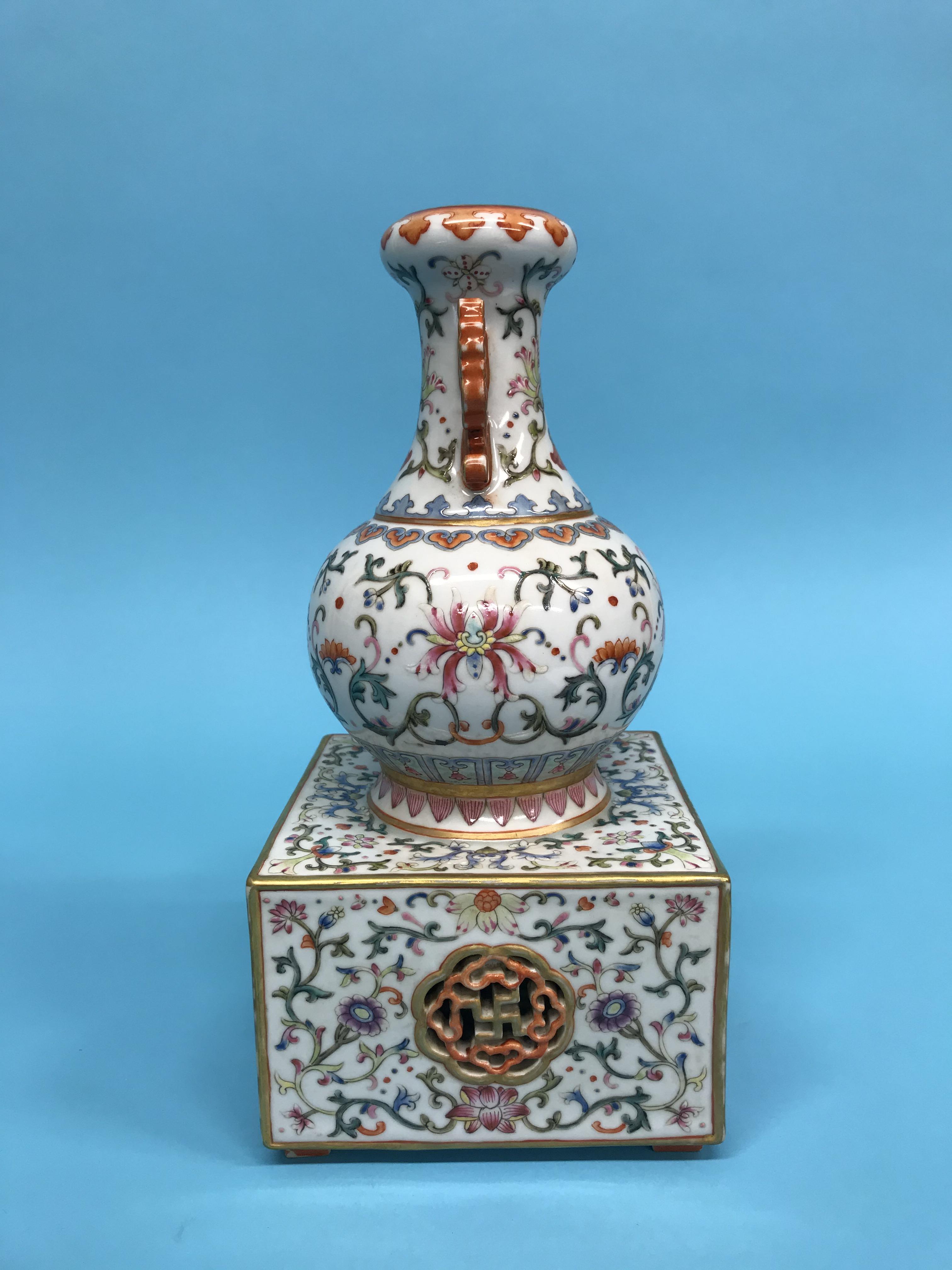 An unusual Chinese Famille Rose two handled vase, supported on a square and pierced base, mark in - Image 9 of 17