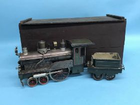 A boxed tinplate train engine and tender