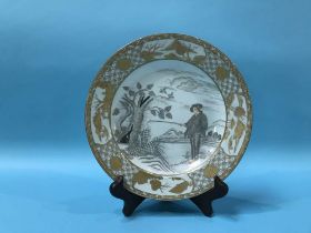 A Chinese circular export plate, decorated with a fisherman, and gilt border