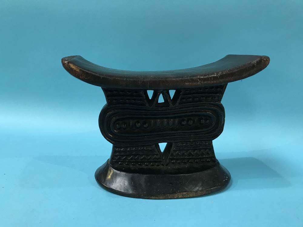 A late 19th century tribal carved wood head rest, W 20cm H 12cm