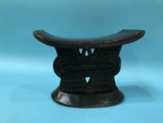 A late 19th century tribal carved wood head rest, W 20cm H 12cm