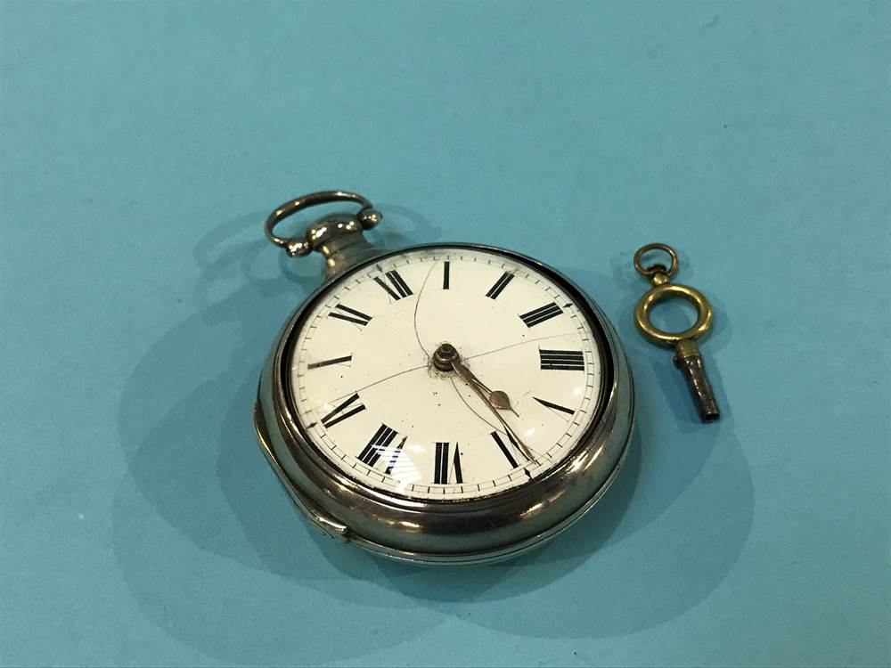 A silver pair cased pocket watch