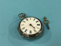 A silver pair cased pocket watch