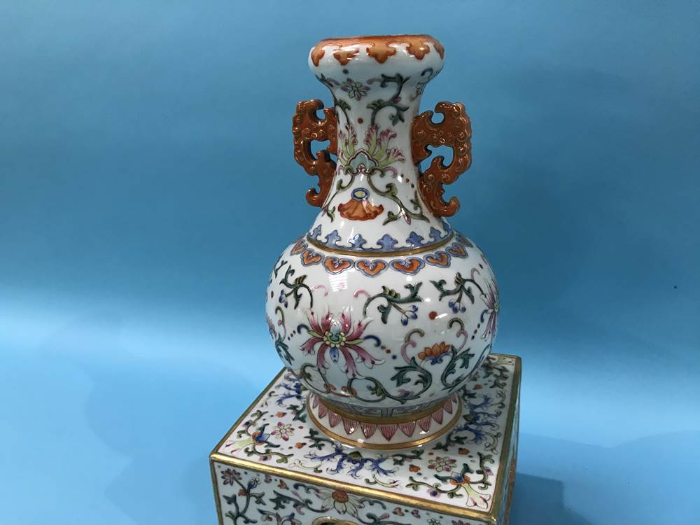 An unusual Chinese Famille Rose two handled vase, supported on a square and pierced base, mark in - Image 2 of 17