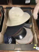A Pith helmet and various hats
