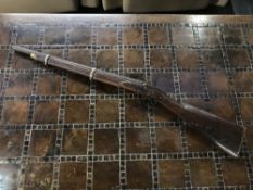 An antique percussion rifle