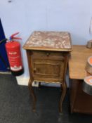 Continental walnut and marble top bedside cabinet