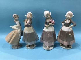 Three Lladro Dutch figures and a Nao figure