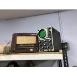 An oscilloscope and two radios