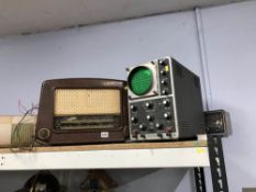 An oscilloscope and two radios