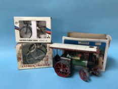 A boxed Mamod steam tractor and two boxed model bikes