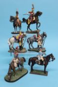 A collection of six various metal painted military figures on horseback