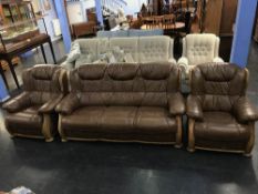 Brown leather three piece suite