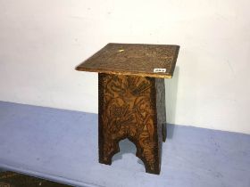 A square carved stool, with lid