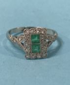 A 22 stone emerald and diamond platinum cluster ring, 2.8g