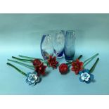 Three Caithness 'Dolphin' glass vases and seven glass flower stems