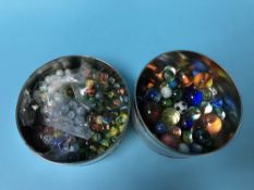 Two tins of marbles
