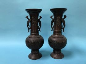 A pair of decorative Japanese metalware two handled vases, H 37cm