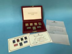 Sterling silver replica stamps, set of seven in case, 5.5 ounces