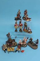 A collection of ten various metal painted military figures, a dining table and accessories