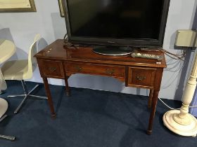 A yew three drawer side table