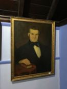 Victorian School, oil, unsigned, half length portrait of a Gentleman seated beside a table, 76 x