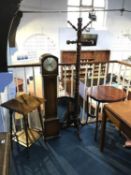 Two occasional tables, an oval mirror, a coat stand and a Grandmother clock