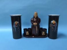 A Monk decanter and six tumblers and a pair of vases