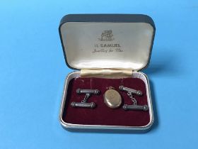 Pair of silver cufflinks and a locket