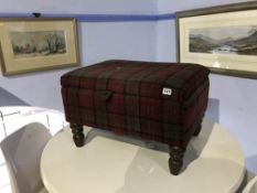 A tartan upholstered stool