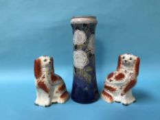 Two Staffordshire Spaniels and a tall Royal Doulton vase