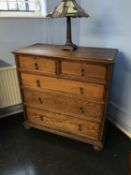 Oak chest of drawers with two small and three long graduated drawers, supported on bun feet, W