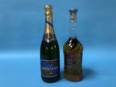 A bottle of Jack Daniels Bicentennial whiskey and a bottle of De Venogue champagne, 1999