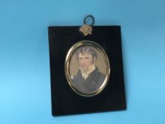 A miniature portrait of a Gentleman, with ebonised mount and gold plated frame