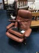 Brown leather swivel chair and stool