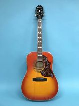 An Epiphone Hummingbird Pro/FC guitar and case