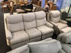An electric reclining three seater settee, armchair and footstool