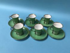 A set of six silver mounted Aynsley coffee cans and saucers