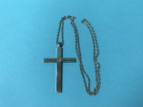 A diamond mounted crucifix, approx. 0.75ct, chain stamped '750', 48.4g