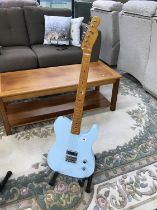 A blue electric guitar