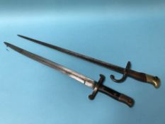 Two Bayonets, one with sheath