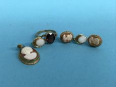 A 9ct gold garnet set dress ring, a 9ct mounted cameo pendant and two pairs of earrings