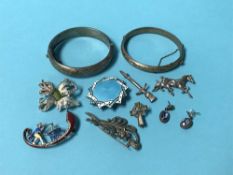 Two silver bangles and enamelled brooches etc.