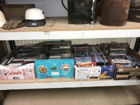 Four trays of CDs and DVDs