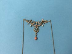 A seed pearl and coral mounted pendant and chain, stamped '15', 7.7g