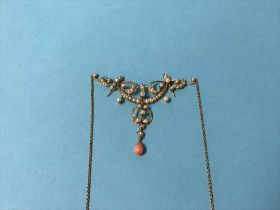 A seed pearl and coral mounted pendant and chain, stamped '15', 7.7g