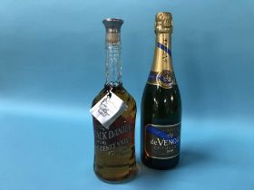 A bottle of Jack Daniels Tennessee Bicentennial whiskey and a bottle of De Venoge champagne