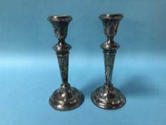 Pair of silver candlesticks, with loaded bases, marks rubbed