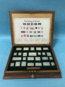 A cased set of Sterling silver stamps, set of 25, weight 15.5 oz