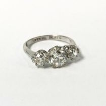 A platinum three stone diamond ring, central stone approx. 1.5ct, two on shoulder approx. 0.5ct